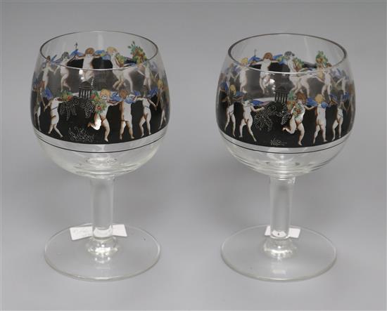 A pair of Vetri Della Arte goblets, enamelled with a frieze of putti height 19.5cm